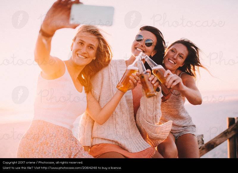 2064248-group-of-young-adult-woman-drinking-beer-and-taking-selfie-photocase-stock-photo-large.jpeg