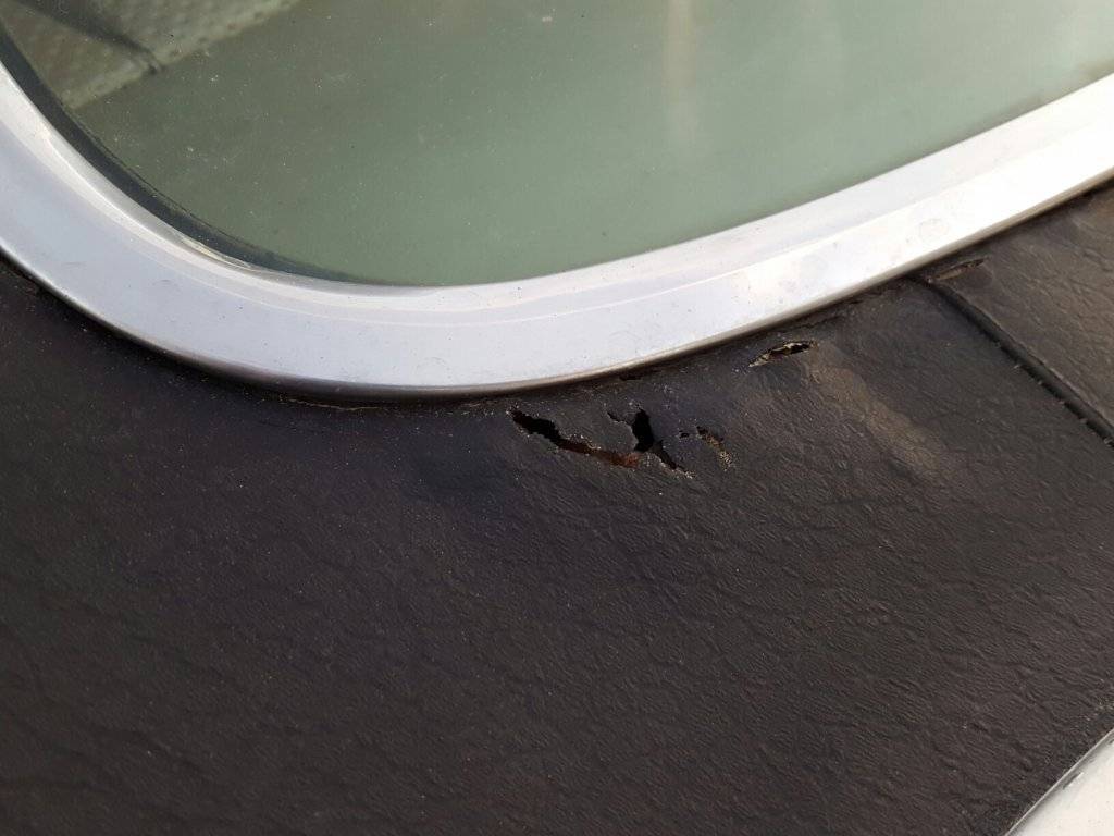 300 rear window rust hole.jpeg