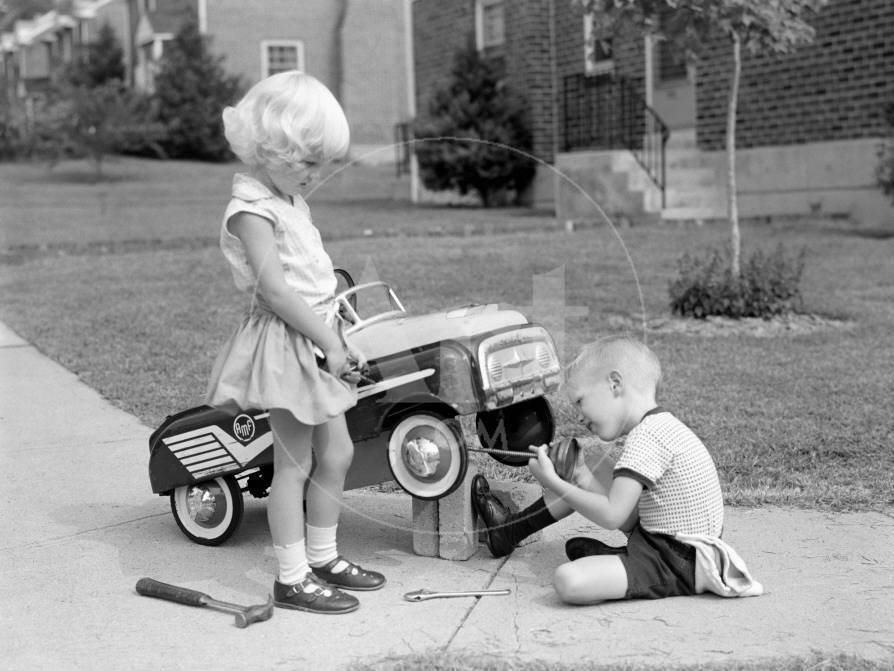 -children-on-suburban-sidewalk-boy-playing-as-mechanic-oiling-toy-pedal-car_a-G-7994466-14258388.jpg