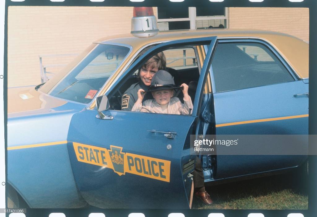 female-state-trooper-with-son-in-patrol-car.jpg