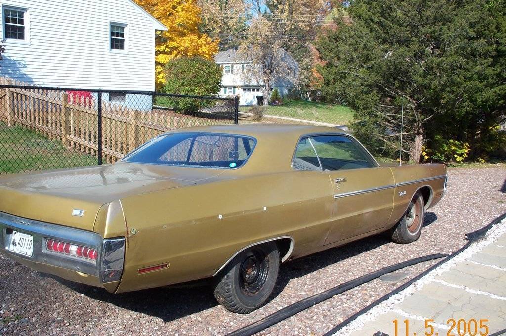 Gold Rt rear Qtr side.jpg