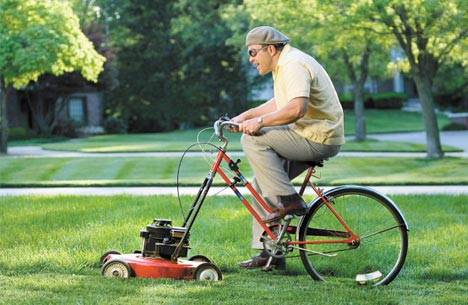 guy-riding-bicycle-lawnmower.jpg