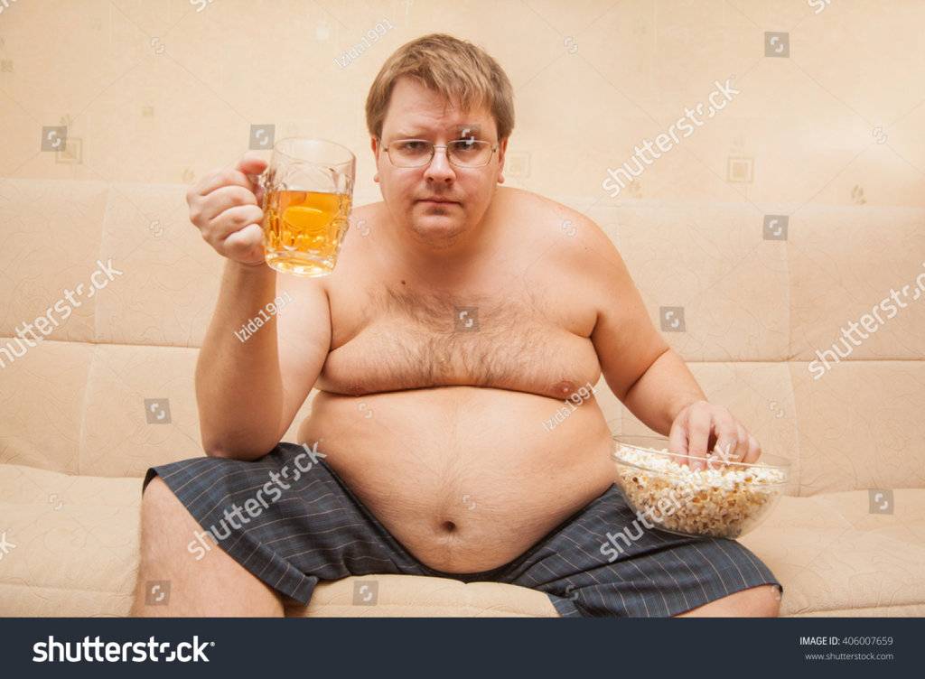 stock-photo-fat-man-eating-popcorn-and-drinking-beer-406007659.jpg