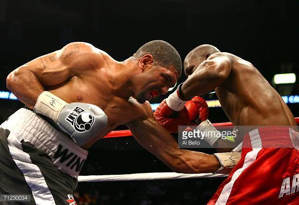 winky-wright-lands-a-low-blow-against-jermain-taylor-during-their-picture-id71230034?s=612x612.jpg